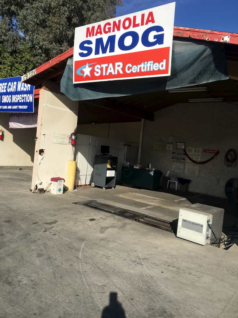 Santee Smog Check test bay on Magnolia Ave, Santee — free car wash with smog inspection banner